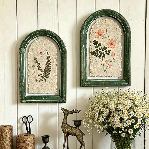 Two pressed flower arch frames in distressed green wood